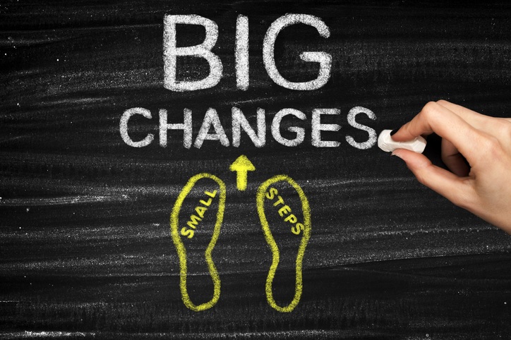 "Small steps, big changes" written on a chalkboard