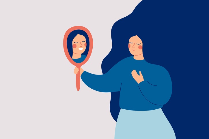 Cartoon of a woman looking into a handheld mirror with her reflection smiling back at her